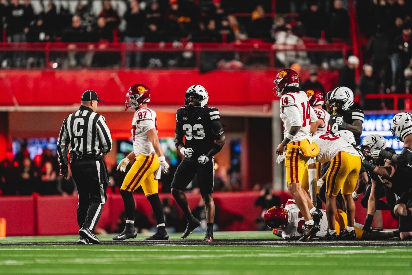 Marques Watson Trent, number 33, on the field for Nebraska