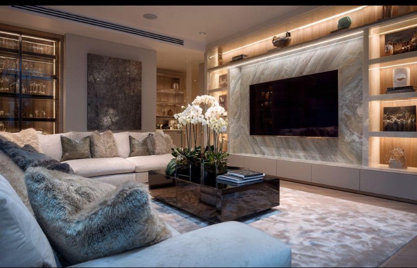 Backlit marble television wall with illuminated shelving niches