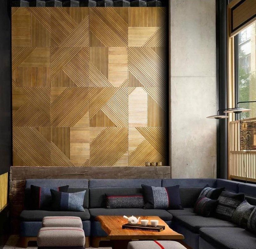 Geometric ribbed wood relief panels above a lounge sofa