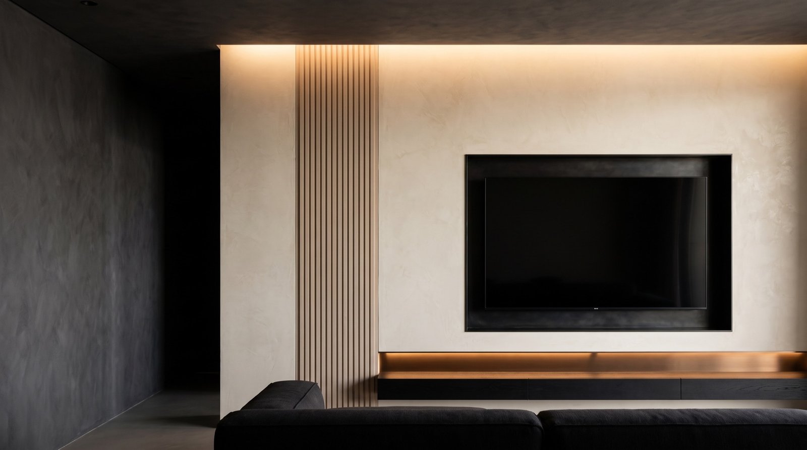Living room after: warm ivory plaster feature wall with a fluted white oak band, a recessed television niche and a lit floating console