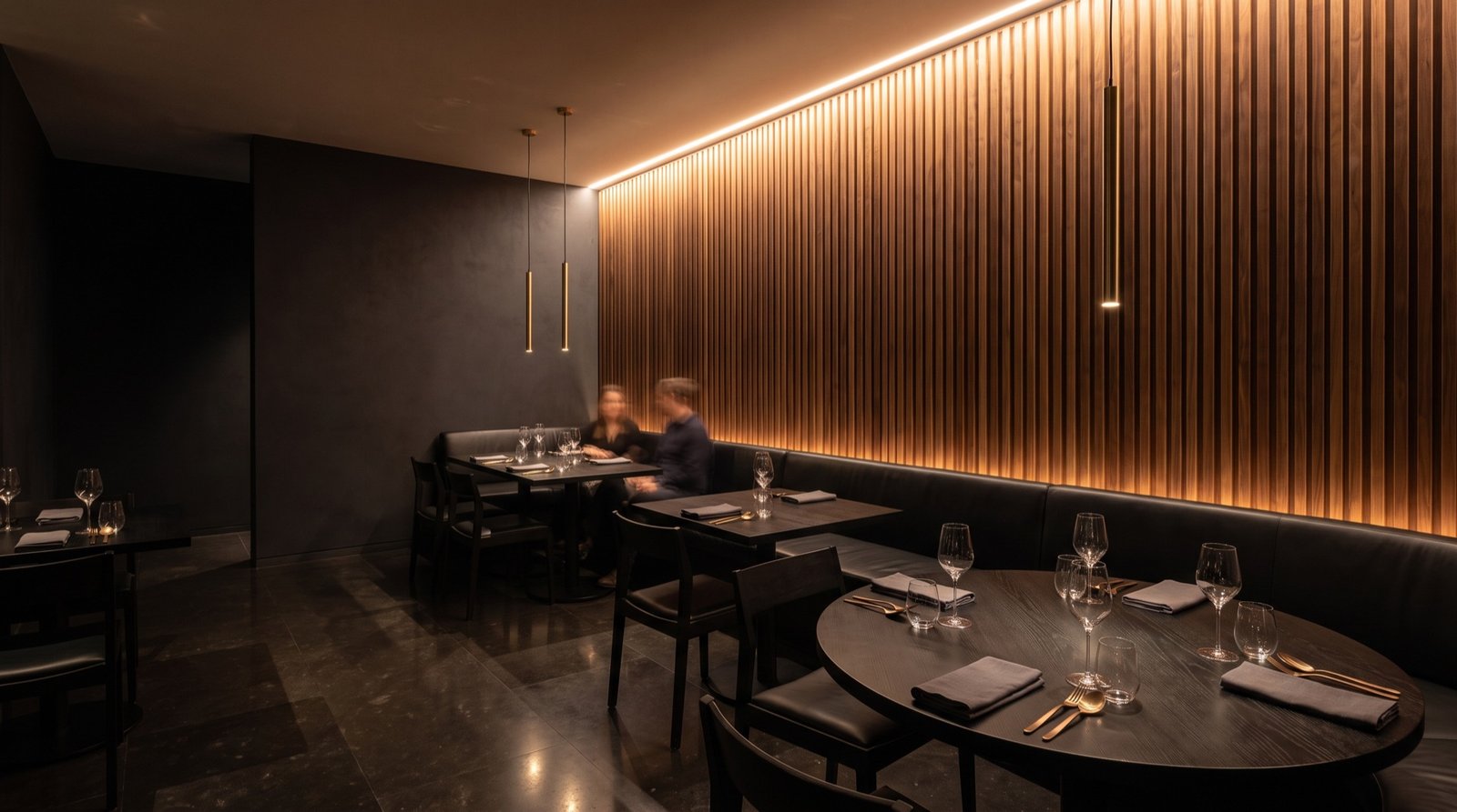 A dining room with nothing to look at became a room built around one wall.
